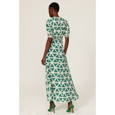 Green printed viscose (100% Viscose). Lining (100% Polyester). Hourglass. V-neck. Short sleeve. Back zipper closure. 56" from shoulder to hemline. Imported. Printed V-neck Rayon Maxi Dress, Printed Rayon V-neck Dress, Printed Rayon Midi Dress With Short Sleeves, Green Viscose V-neck Maxi Dress, Green V-neck Viscose Maxi Dress, Printed Rayon V-neck Maxi Dress, Printed Rayon Maxi Dress With V-neck, Green Rayon V-neck Dress, Printed V-neck Rayon Dress