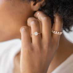 a close up of a person wearing two rings