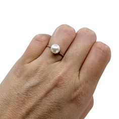 This is a simple but beautiful & authentic Mikimoto Japanese akoya saltwater cultured pearl solitaire ring. The pearl is 8.00mm round. It has great luster with rosy pink overtones. It is set in place by claw prongs and fine under gallery work. It is stamped "M" in a clamshell for Mikimoto and "S" in a square for silver. Ring size is 6 US. From Japan, 1920's-1960's. All pearls are truly vintage and have only been lightly cleaned. Cultured Pearl Ring, Claw Prong, Rosy Pink, Vintage Pearls, The Pearl, Earrings Collection, Pearl Ring, Cultured Pearls, Tassel Earrings