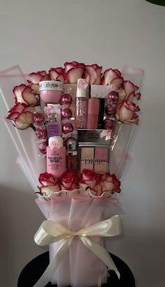 a bouquet of flowers with cosmetics and lipstick