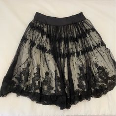 Beautiful Vintage Black Lace Skirt With Cream/White Slip Lining Originally Purchased From Saks Fifth Avenue And Never Worn Approximately 26 Inches Long There Is A Very Small Hole/Tear In The Lace Mesh (See Last Picture) Close To The Side Zipper - This Must Have Occurred At Some Point When I Was Trying On The Skirt And The Lace Snagged In The Zipper - However It’s Very Small And Cannot Be Noticed When Worn Note: This Is Not Tara Jarmon For Target - This Is Actual Original, And Now Vintage Tara Ja Spring Party Skirt With Lace Trim, Summer Evening Skirt With Lace Trim, Elegant Flowy Mini Skirt With Lace Trim, Summer Evening Lace Skirt, Elegant Flowy Lace Trim Mini Skirt, Party Flared Skirt Bottoms With Lace Trim, Evening Lace Midi Skirt, Lace Pleated Mini Skirt, Elegant Fitted Mini Skirt Petticoat