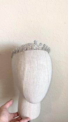 This Royal Inspired Bridal Tiara, adorned with flawless Simulated Diamond Cubic Zirconia, radiates breathtaking beauty and romance. 

Its luxurious quality and classic elegance make it the perfect choice for a bride seeking a rich and timeless look fit for royalty. Eternal Marriage, Wedding Tiara Veil, In The Name Of Love, Dreamy Gowns, Bridal Tiaras, Diamond Tiara, Sparkle Wedding, Wedding Accessories Jewelry, Breathtaking Beauty