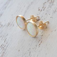 Opal earrings stud,opal earrings,white opal earrings,opal studs,gold opal earrings Cute little shiny gold filled or sterling silver 6mm opal earrings. Simple, clear, clean jewelry. Perfect for everyday. Great gift. **Size - 6mm **Made from 14k gold filled/ sterling silver Here some more earrings: https://www.etsy.com/listing/151878552/gold-earringslove-earrings-simple?ref=shop_home_active https://www.etsy.com/listing/151045543/gold-earrings-resin-earrings-simple?ref=shop_home_active Please visit Minimalist Hypoallergenic Opal Earrings, Hypoallergenic Round Opal Jewelry, Minimalist Ethiopian Opal Round Jewelry, Minimalist Opal Earrings, Opal Jewelry With Matching Earrings For Anniversary, Dainty Round Ethiopian Opal Jewelry, Classic Opal Jewelry For Gifts, Classic Opal Jewelry As A Gift, Round Ethiopian Opal Jewelry For Gift