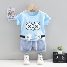 Grow Boy Cartoon Patten Top & Denim Shorts - PrettyKid Playful Summer Sets With Character Print, Blue Cartoon Print Bottoms For Summer, Light Blue Cotton Sets For Summer, Playful Character Print Sets For Spring, Playful Light Blue Cartoon Print Sets, Casual Denim Sets For Summer, Fun Cotton Summer Sets, Playful Cartoon Print Shorts For Summer, Playful Bottoms With Cartoon Print For Summer