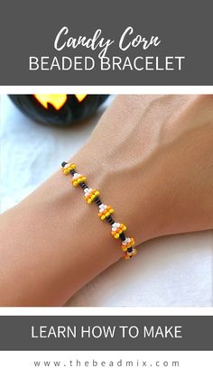 a woman's hand wearing a beaded bracelet with the words candy corn beaded bracelet