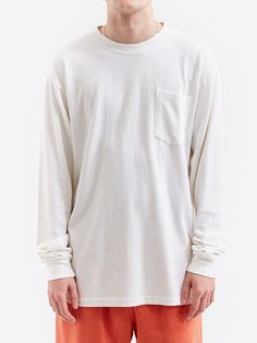 Elevate your basics with this Goodhood Worldwide crisp white long sleeve sleeve crewneck t-shirt, featuring a single breast pocket. 100% Cotton Garment Dyed 300 GSM Long Sleeve Crewneck *Model is 6'2" and wears a size Large *Womens Model is 5'10" and wears a size Small White Long Sleeve Top With Pockets, Oversized Long Sleeve T-shirt With Pockets, Basic Crew Neck Sweatshirt With Pockets, White Crew Neck Top With Side Pockets, White Tops With Side Pockets For Streetwear, White Cotton Sweatshirt With Side Pockets, White Cotton Tops With Side Pockets, Cotton Crew Tops With Side Pockets, White Crew Neck Sweatshirt With Pockets