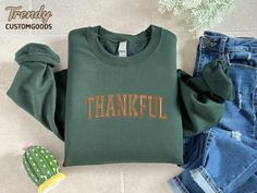 Embroidered Thankful Sweatshirt,Thanksgiving Embroidery Crewneck,Fall Clothing,Autumn Sweatshirt,Thankful Embroidery Sweater,Thankful Gift HOW TO ORDER 1-) Please, check and review all the photos. 2-) Select Your Size and Color from drop down menus. 3-) Click add to cart. You can go back to add more sweatshirts. 4-) Click "Proceed to check out" to purchase your order. 5-) When you check out, you can add a note to seller for any request. SIZING We are using Unisex sizing sweatshirts for a casual and relaxed fit. That means they run slightly larger than typical women's one and slightly smaller than typical men's ones. ✔ Please refer to the size chart style before you place your order to find the right fit for your style. 👕UNISEX SWEATSHIRTSS SIZING RECOMMENDATIONS 📌For a Slim Fit - Size On Green Sweatshirt With Letter Embroidery For Fall, Green Letter Embroidery Sweatshirt For Fall, Embroidered Green Sweatshirt For Fall, Green Top With Letter Embroidery For Fall, Fall Crew Neck Tops With Machine Embroidery, Fall Crew Neck Sweatshirt With Machine Embroidery, Casual Fall Sweatshirt With Machine Embroidery, Casual Machine Embroidered Sweatshirt For Fall, Thanksgiving Embroidery