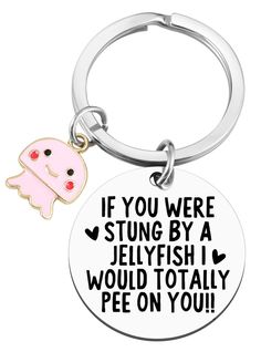 a keychain with a cartoon character on it that says if you were strung by a jellyfish i would totally pee on you