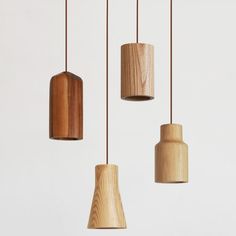 three wooden lights hanging from the ceiling