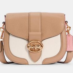 Product Details Light Pink/Cream/Ivory And Gold Accents Refined Pebble Leather And Smooth Leatherinside Multifunction Pocketssnap Closure, Fabric Liningoutside Open Pocketdetachable Strap With 20 3/4" Drop For Shoulder Or Crossbody Wear 8 1/4" (L) X 6 3/4" (H) X 2 3/4" (W) Mint, Rare, Nwt With Wrappings, Still In Plastic, Smoke Free Home Luxury White Saddle Shoulder Bag, Chic Beige Saddle Bag, Chic Cream Coach Shoulder Bag, Designer Cream Crossbody Shoulder Bag, Chic Cream Coach Bag, Beige Coach Bag With Detachable Strap, Designer Cream Bags With Adjustable Strap, Coach Cream Bags With Removable Pouch, Coach Bags With Removable Pouch In Cream