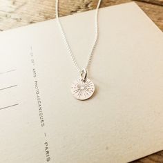 New! Radiant beams of light grace this small round charm and remind us to shine brightly, wherever we go. Down Arrow Icon, Beams Of Light, Light Necklace, Message Necklace, Be The Light, Travel Light, Chain Earrings, To Shine, Live Light