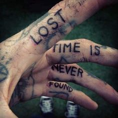 two hands with words written on them that say lost, time is never fondd