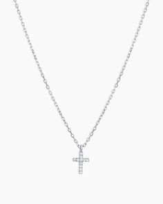 This understated diamond cross necklace can beautifully add to any outfit with its subtle shimmer. To enhance your look, layer your dainty diamond necklace with other chains or add a pop of color with a strand of beautiful gemstones. Diamond Cross Necklace in 14k Solid White Gold, Women's by gorjana White Gold Cross Necklace With Adjustable Chain, Elegant Crucifix Jewelry With Delicate Chain, Dainty Diamond Cross Pendant Jewelry, Dainty Cross Necklace In Cubic Zirconia, Elegant Cross Necklace With Delicate Chain, Dainty Cubic Zirconia Cross Necklace, Elegant Sterling Silver Cross Necklace With Delicate Chain, Elegant White Gold Cross Necklace With Adjustable Chain, Elegant Cable Chain Jewelry With Cross Pendant