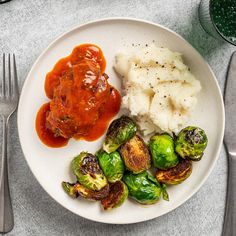 a plate with brussel sprouts, mashed potatoes and brussels sprouts