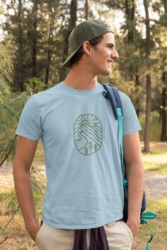 Mountain T-shirt, Unisex Heavy Cotton Tee, Outdoor Apparel, Hiking T-shirt, Mountain Outline, Minimalist Mountain Shirt, Mountain Apparel You have found the best outdoor t-shirt for your wardrobe. The unisex heavy cotton tee is the basic staple of any wardrobe. It is the foundation upon which casual fashion grows. All it needs is a personalized design to elevate things to profitability. The specially spun fibers provide a smooth surface for premium printing vividity and sharpness. No side seams Cotton Crew Neck T-shirt For Outdoor Activities, Green Crew Neck T-shirt For Outdoor Activities, Green Crew Neck T-shirt For Outdoor, Blue Short Sleeve T-shirt For Outdoor, Blue Graphic Tee For Outdoor Activities, Blue Relaxed Fit T-shirt For Outdoor Activities, Blue Outdoor Tops With Screen Print, Green Short Sleeve T-shirt For Outdoor, Blue Tops With Screen Print For Outdoor Activities