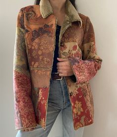 Rare find! Absolutely incredible Y2K jacket with so many eye-catching details : various florals, paisley, patchwork and faux fur throughout. Warm and comfortable! The brand is Hugging Kisses. Made in China. Made of 100% polyester.  Size on tag is small. Model is a size small. Can most likely fit up to a medium - please refer to measurements by comparing them to a similar item of yours. Includes an extra button. The cleaning instructions say "dry clean only" but it's been hand-washed without issu Bohemian Floral Print Outerwear For Fall, Fall Multicolor Floral Patchwork Outerwear, Vintage Floral Patchwork Outerwear For Fall, Vintage Outerwear With Floral Patchwork, Vintage Winter Outerwear With Floral Patchwork, Vintage Brown Patchwork Outerwear, Hippie Brown Outerwear For Fall, Retro Floral Print Winter Outerwear, Hippie-style Fitted Winter Outerwear