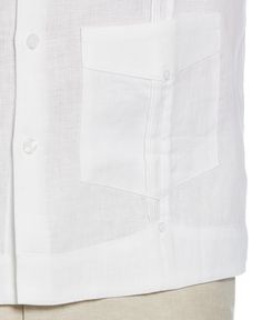 This Cubavera men's short sleeve guayabera is a classic blend of comfort and style. Crafted from 100% durable, plain weave linen, it features short sleeves and the traditional four-pocket design. This button-up dress shirt encapsulates timeless guayabera styling, making it a versatile addition to any wardrobe. The perfect fusion of tradition and elegance, this shirt effortlessly elevates your casual or formal looks. 100% Linen Classic Fit Plain Weave Fabrication Weaves In Criss-Cross Patterning White Short Sleeve Shirt With Patch Pockets, White Camp Shirt With Pockets And Camp Collar, Classic Button-up Camp Shirt With Patch Pockets, White Relaxed Fit Camp Shirt With Pockets, Classic Short Sleeve Shirt With Flap Pockets, White Short Sleeve Shirt With Camp Collar And Pockets, White Short Sleeve Shirt With Pockets And Camp Collar, Classic Summer Camp Shirt With Pockets, White Short Sleeve Shirt With Spread Collar And Pockets