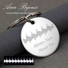 an engraved jewelry design keychain with a sound wave on it and the words always hear, never pay