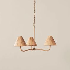 three light chandelier with beige shades