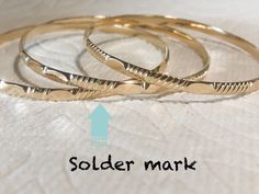 "The rings color in the picture is slightly different to the actual color. Gold Filled is displayed as \"Jewelry Gold\". Please do not compare to your existing rings. We cannot guarantee our rings' color will be exactly matched the color of your other existing rings. All bangle bracelet are tailor-made according to the size requested by the customer. No returns or exchanges Fast Processing Time: It will take me 1 -2 days to ship out your item. Details : - Width: 3.8 mm, Due to hand-made, the wid Hypoallergenic 14k Gold Round Bracelet, Dainty Stackable Round Bangle, Handmade Round Bangle For Everyday, 14k Stamped Round Bangle For Gift, Adjustable Tarnish Resistant Bangle, Handmade Gold Bangle Bracelet For Everyday, Dainty Handmade Gold Bracelet, Everyday Handmade Bangle, Hypoallergenic Gold Round Bangle