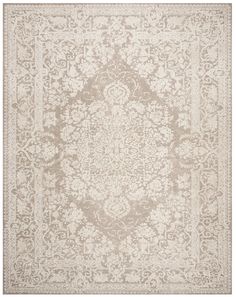 a beige and white rug with an intricate design