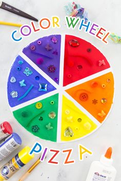 the color wheel is shown with paint and craft supplies