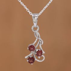 Swirling silver strands culminate in a trio of radiant garnets in this simply elegant pendant necklace. From Alok Jain of India, the necklace is handcrafted from sterling silver and plated with bright rhodium. Silver Strand, Ruby Pendant, Garnet Pendant, Elegant Pendant, Jewelry Packaging, Pretty Jewellery, Jewelry Gift Box, Free Jewelry, Spring Rings