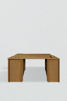 an office desk made out of cardboard on a plain surface with no one around it