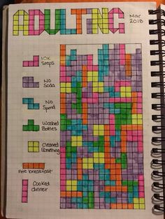 an open notebook with colored squares and words on it that spell out the word quilting