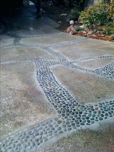 a bench sitting on the side of a road next to a sidewalk with circles painted on it