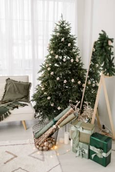 a living room with christmas trees and presents