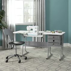 a sewing machine sitting on top of a white desk next to a black and gray chair