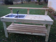 a wooden bench with a sink in it