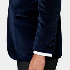 This navy dinner jacket is cut to a tailored fit, providing a slim chest and waist for a fitted silhouette and a natural shoulder design. It features a straight peak lapel, jetted pockets, and a half-canvas construction. Luxury Tuxedo With Double Button Closure And Lapel Collar, Luxury Navy Blazer With Welt Pockets, Luxury Long Sleeve Tuxedo With Concealed Placket, Evening Tuxedo With Welt Pockets And Long Sleeves, Tuxedo Sport Coat With Lapel Collar And Double Button, Tuxedo Sport Coat With Double Button And Lapel Collar, Long Sleeve Evening Tuxedo With Welt Pockets, Fitted Tuxedo With Double Button Closure, Luxury Fitted Tuxedo With Double Button Closure