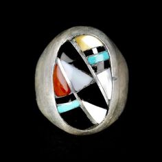 Wonderful Vintage Zuni Ring by Ralph and Lillie Kallestewa, they have been active jewelers since the 1950s.This ring is a  Multi Stone Sterling Silver Inlay, with Turquoise, Jet, Mother of Pearl and Coral.  This ring will look great on both men and women. Size 10 1/2 Measures 1 " tall Weight 18.9 grams Collectible Multi-stone Turquoise Oval Ring, Multicolor Inlay Rings For Anniversary, Artisan Rings With Inlay For Anniversary, Anniversary Multicolor Inlay Rings, Unique Multicolor Rings With Polished Finish, Collectible Vintage Turquoise Ring With Polished Finish, Vintage Turquoise Ring With Polished Finish, Southwestern Style Rings With Inlay, Southwestern Round Rings With Inlay