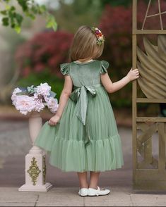 Are you looking for the perfect velvet flower girl dress? The Little Kitten Boutique has a large variety of styles and colors for any wedding style from boho to beach. Designed to make every little girl feel like a princess, this gorgeous short sleeve velvet and tulle dress is the epitome of whimsy and elegance, perfect for any special occasion. Available in toddler, girl and junior bridesmaids sizing.. Whimsical DesignThis stunning Girls dress features a lux sage velvet bodice with short ruffle sleeves that transitions into a full sage green tulle skirt with mermaid layer,with a matching sage green velvet sash, creating a beautiful contrast that is both eye-catching and timeless. The gorgeous velvet adds a touch of vintage charm, making this dress a standout choice for any event. Perfect Green Tulle Skirt, Green Flower Girl Dresses, Long Flower Girl Dresses, Tulle Flower Girl Dress, Green Tulle, Tulle Flower Girl, Tulle Flowers, Velvet Flowers, Flower Girl Dresses Tulle