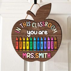 this classroom you are an apple ornament with crayons on the front