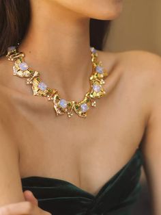 Description: Elevate your evening attire with this exquisite Arbor Opal Vintage Necklace Crafted with intricate attention to detail, this necklace features vibrant opal and green gemstones set in a golden brass base, showcasing a luxurious shine and unique texture. The necklace is designed with a total length of 33.5 cm, with an adjustable 8 cm extender to ensure a perfect fit for every neckline. At approximately 85 grams, this necklace offers a comfortable yet bold presence, making it the perfect accessory for special occasions or to add a touch of elegance to any outfit. Details: Material: Brass with gold plating, opal and green gemstones Length: 33.5 cm with an 8 cm extender Weight: Approximately 85 grams Handcrafted design for a unique and luxurious feel Care Instructions: Avoid contac Pearl Jewelry Necklace, Natural Stones Necklace, Gold Statement Earrings, Natural Stone Jewelry, Necklace Craft, Natural Stone Bracelets, Anklet Bracelet, Green Gemstones, Anklet Jewelry