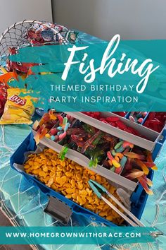 a fishing themed birthday party with candy and candies in a box on the table