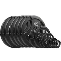 a set of black rubber weight plates with numbers on the front and back, all lined up in rows