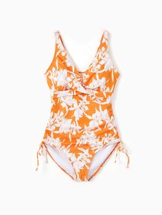 Family matching outfits with orange floral design, featuring drawstring swim trunks or a one-piece swimsuit with crisscross front and adjustable drawstring sides. Perfect for swimming, lounging at the pool or beach, and summer vacations.
* Please add each size separately to your shopping cart.
* Each size includes a one-piece swimsuit or a pair of swim trunks. 
* Drawstring swim trunks
* One-piece swimsuit with crisscross front design, removable pads, adjustable drawstring sides
* V-neck for women, round neck for girl
* Tight fit
* For pool, beach, vacation, and swimming
* Imported
* Supplier: PatPat Spring Swimwear With Side Ties For Sunbathing, Summer Swimwear With Side Ties For Swimming, Spring Vacation Swimwear With Side Ties, Spring Swimwear With Cross-tied Design, Summer Cross-tied Swimwear For Spring, Cross-tied Swimwear For Spring, Orange Drawstring Swimwear For Vacation, Drawstring One-piece Swimwear For Beach Season, One-piece Swimwear With Drawstring For Sunbathing