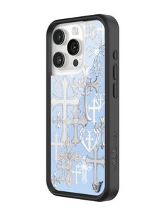 the back of an iphone case with silver crosses and hearts on light blue fabric background