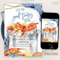 a cell phone next to a card with an image of lobsters in a bucket