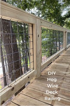 a wooden deck with metal wire railings and trees in the background text reads diy hog wire deck railing