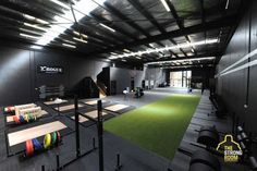 an indoor gym with exercise mats and equipment