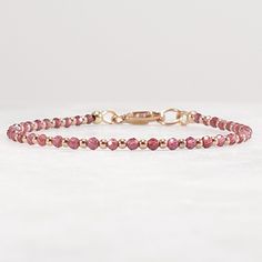 Garnet Bracelet, 14k Rose Gold Filled Bracelet, Dainty Elegant Handmade Bracelet, Stack Bracelet, Gift for Her Mom Wife,  January Birthstone Micro faceted rhodolite garnet beads alternating with 14k rose gold filled beads delicate bracelet.   All strung on cord for durability and a soft drape, finished with a lobster claw clasp.  Great addition to your stacking bracelet collection or wear alone for a minimalist look.  2.0mm micro faceted rhodolite garnet beads 1.5mm tiny 14k rose gold filled bea Elegant Rose Gold Bracelets With Faceted Beads, Rose Gold Faceted Bead Bracelet, Adjustable Faceted Rose Gold Bracelet, Delicate Adjustable Faceted Bracelet, Adjustable Rose Gold Bracelet With Birthstone, Delicate Single Strand Bracelets As Gift, Delicate Single Strand Bracelets For Gifts, Delicate Single Strand Bracelet For Gift, Delicate Single Strand Bracelet Gift