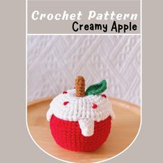 a crocheted apple with a green leaf on top and the words crochet pattern creamy apple above it