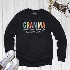 Grandma Sweatshirt With Names, Custom Grandma Sweatshirt, Personalized Grandma Sweater, Gramma Custom Sweatshirt, Custom Mothers Day Shirt. Our Grandma Sweatshirt With Names are Bella+Canvas branded. If Bella+Canvas is out of stock, I will send it from a trusted brand of the same size and quality. You can contact us in case of any problem or request. If you purchase a custom Grandma Sweatshirt With Names, I will send you a message to confirm the design, don't forget to check your message box. Your satisfaction is important to us :) Please check the size chart before purchase Grandma Sweatshirt With Names. We do not accept returns or exchanges on the Grandma Sweatshirt With Names unless there is a mistake or damage caused by us. Please make sure that you get the right size for yourself by l Black Long Sleeve Sweatshirt With Name Print, Long Sleeve Slogan T-shirt, Winter Multicolor Crew Neck T-shirt, Winter Cotton Top With Name Print, Cotton Top With Name Print For Winter, Multicolor Long Sleeve T-shirt For Winter, Multicolor Cotton Sweater With Letter Print, Fall Sweatshirt With Name Print And Long Sleeves, Long Sleeve Cotton T-shirt With Name Print