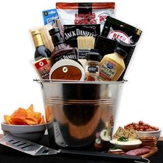 a large metal bucket filled with food and condiments