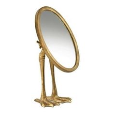 an image of a golden bird standing in front of a mirror